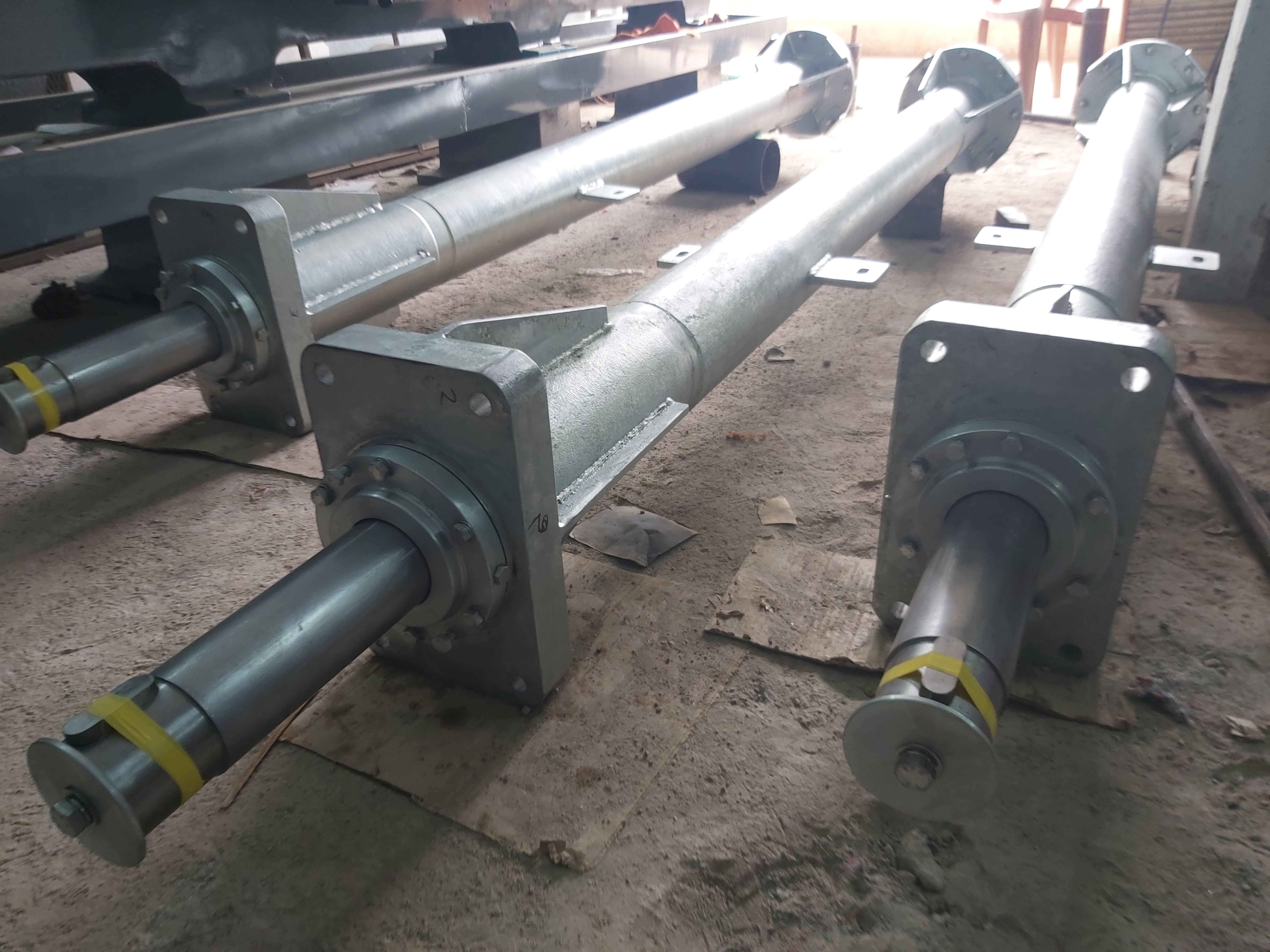 Close-up of finished shaft and flange assemblies